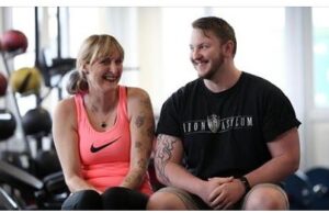 A man and woman smiling at each other