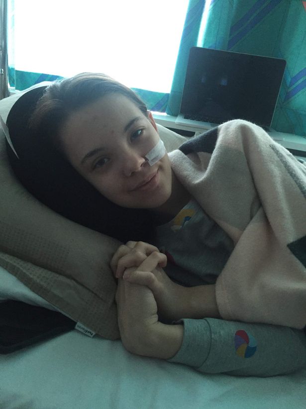 A girl in a hospital bed
