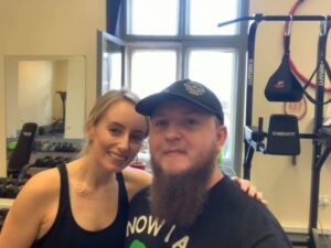 A man and woman smiling