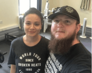 A woman and a man smiling