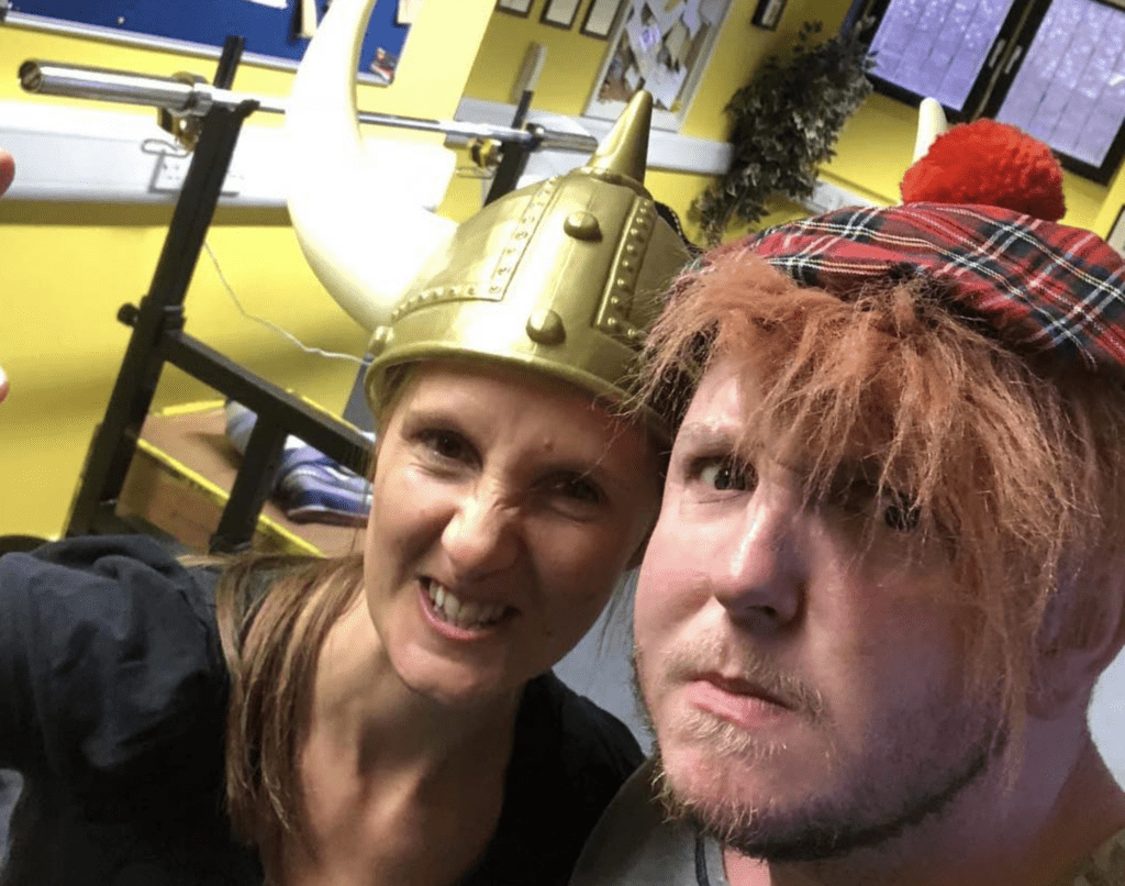 A woman and a man pulling silly faces towards the camera