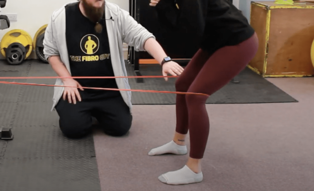 A hypermobility exercise for feet using a band
