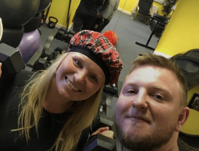 A woman with a Scotland hat on smiling