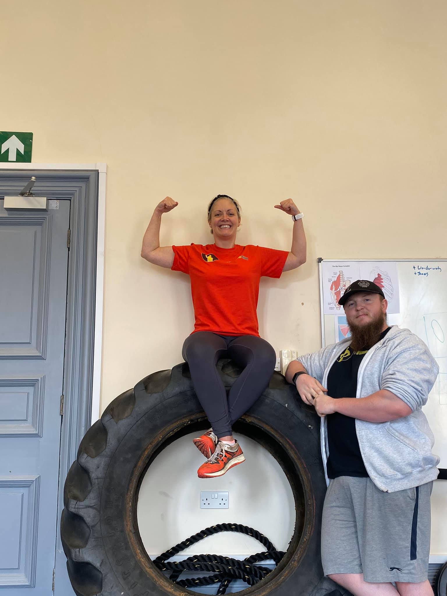 A woman sat on a tyre