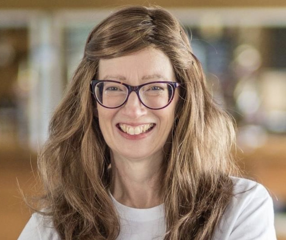 A woman with Ehlers Danlos syndrome wearing glasses