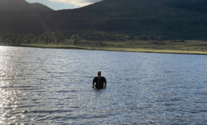 A woman with hypermobility swimming in the sea