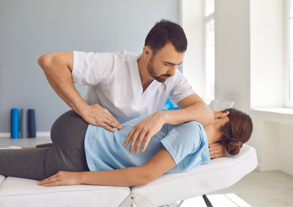 A woman receiving Chiropractic adjustments