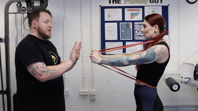 A man and a woman working on hypermobile joints