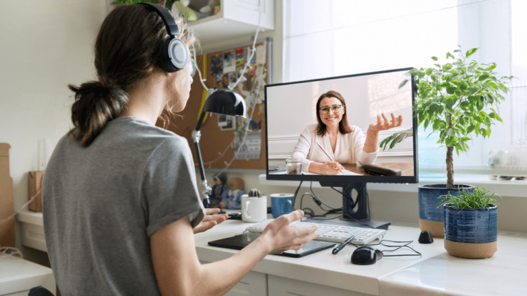 Two women engaged in online counselling
