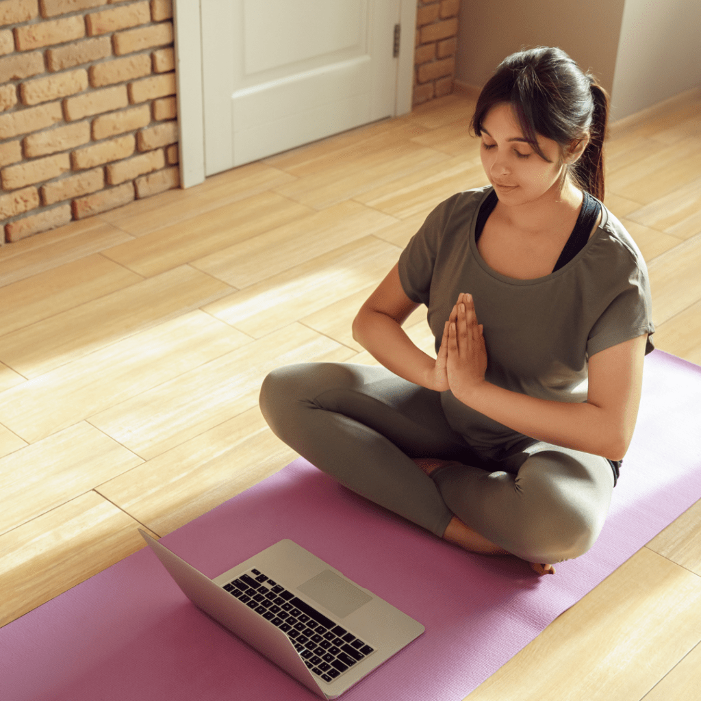 A woman doing yoga online