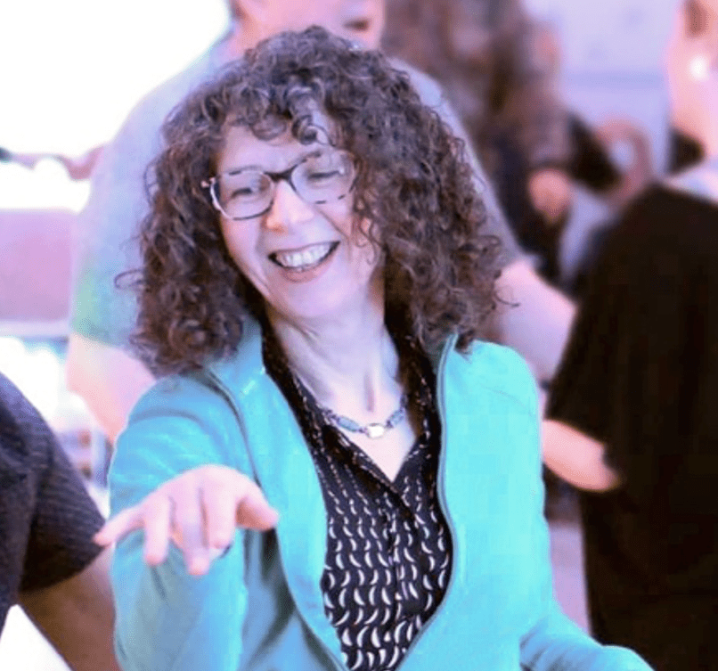 A woman with Curly hair dancing
