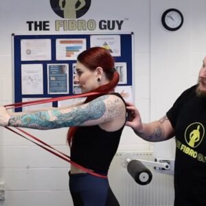 A girl with red hair exercising