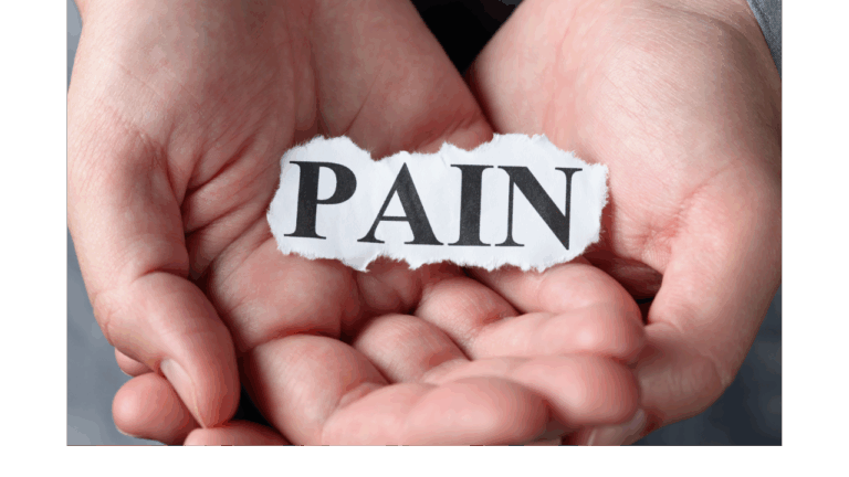 Woman's hands holding the word pain