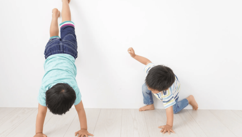 two small male children playing