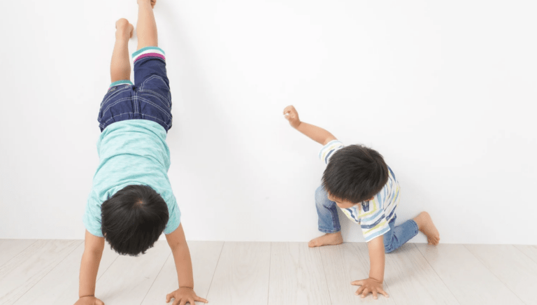two small male children playing