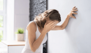A woman struggling with dizziness