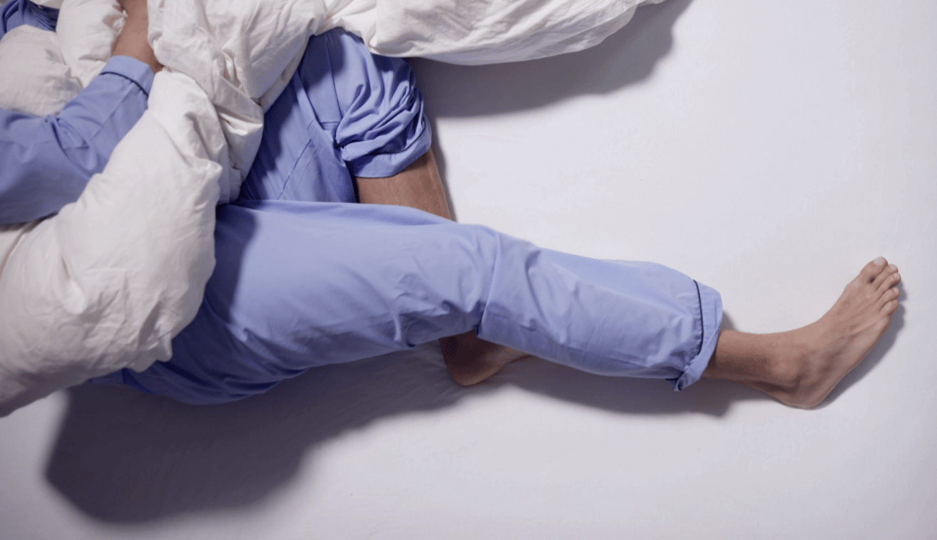 a pair of legs laid on a bed