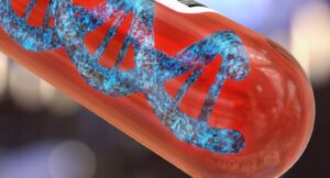 DNA strand inside a blood sample tube, representing genetic research into fibromyalgia